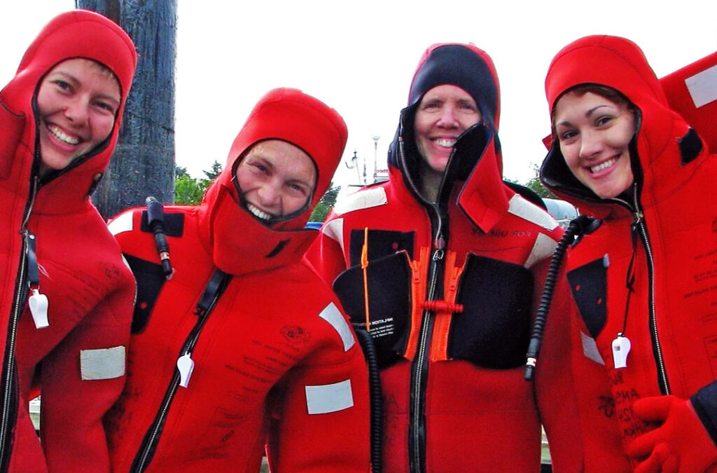 AMSEA smiling four in survival suits